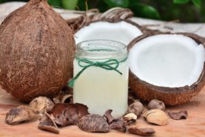Fresh coconut and coconut oil in a jar