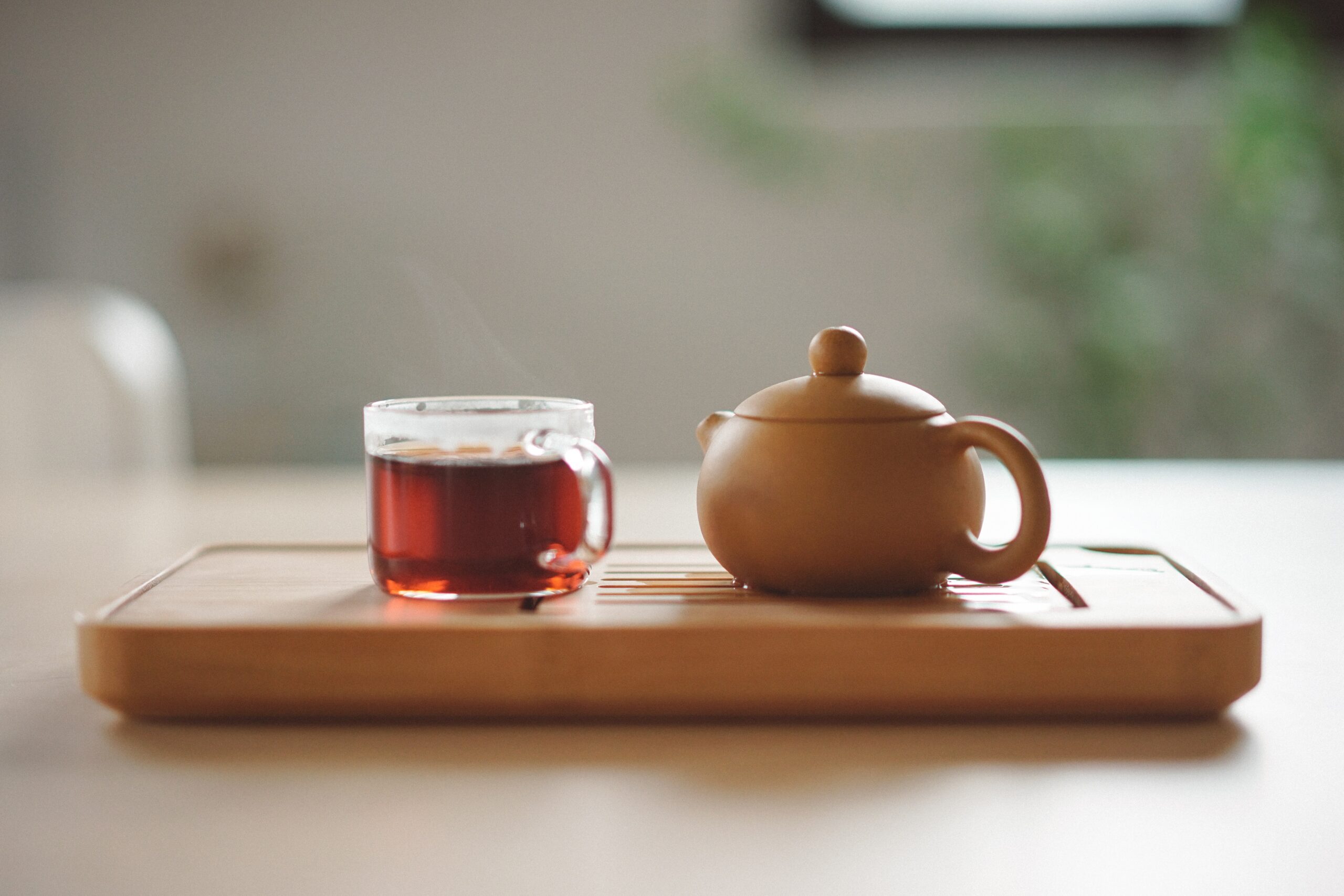 A cup of tea and a tea pot