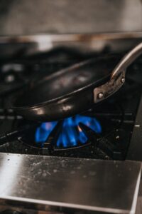 Heating a pan on a gas stove to be used as a way to defrost tortillas