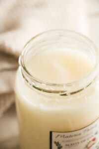 A jar of opened coconut oil