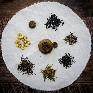 An assortment of different teas on a round napkin