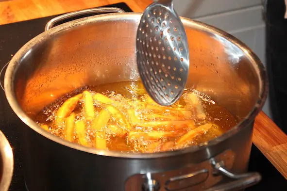 French fries being deep fried