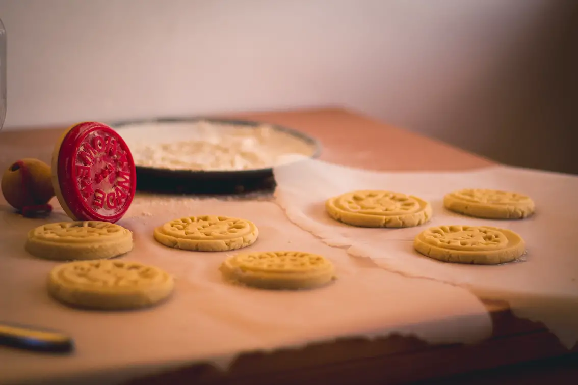 Parchment paper with cookies on top